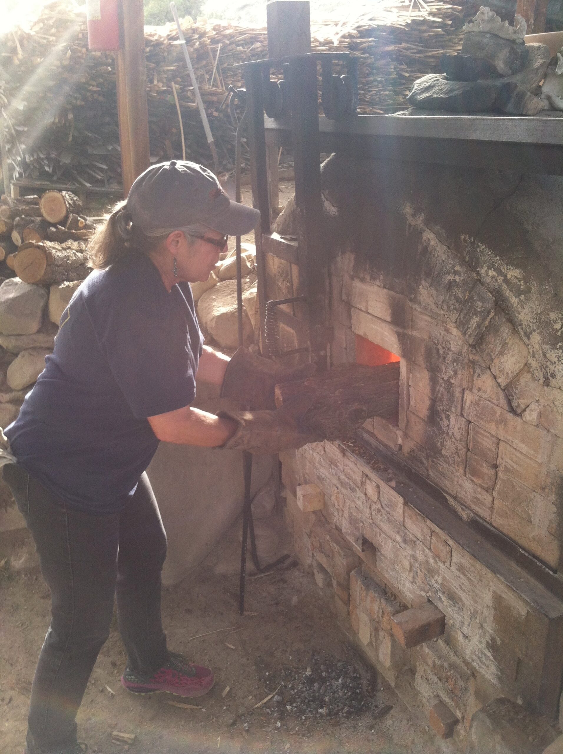 woman stoking firebox